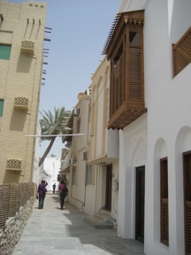 The building on the right has a mashrabiyya screen. Women could see through them what was going on in the street without being seen.